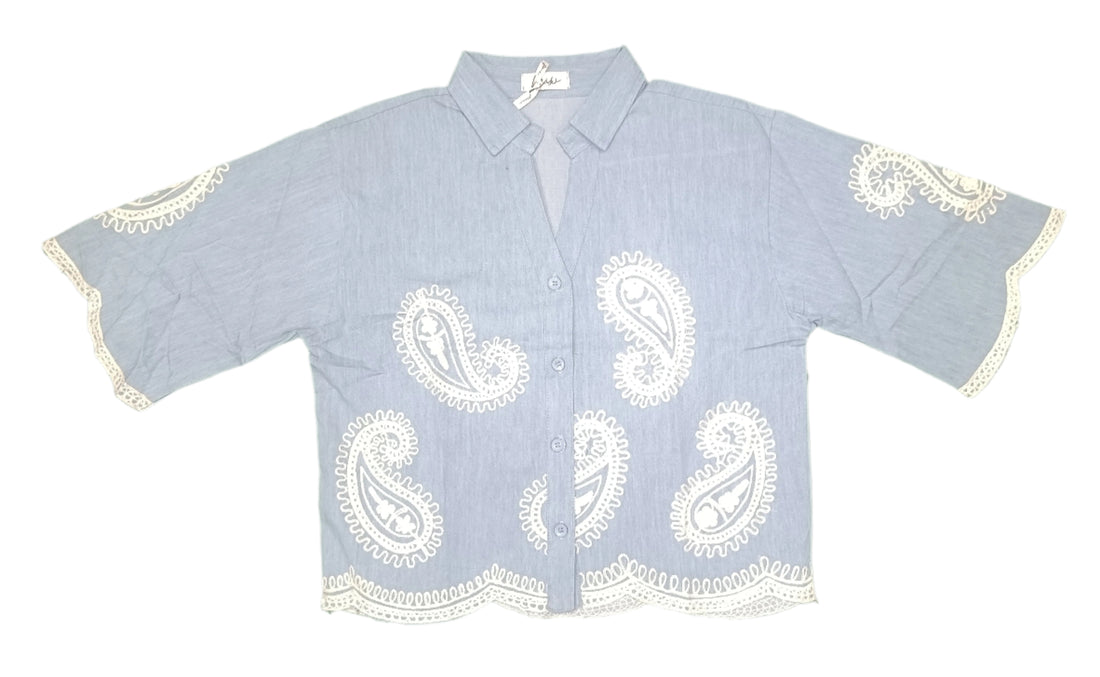 Women's button-up shirt showcases a relaxed fit