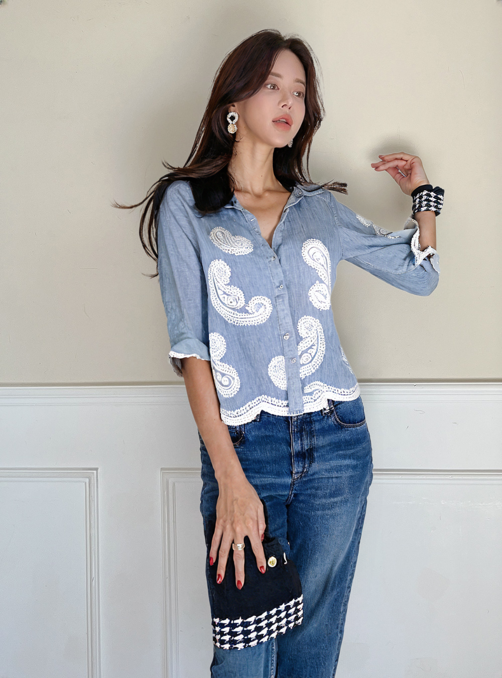 Women's button-up shirt showcases a relaxed fit